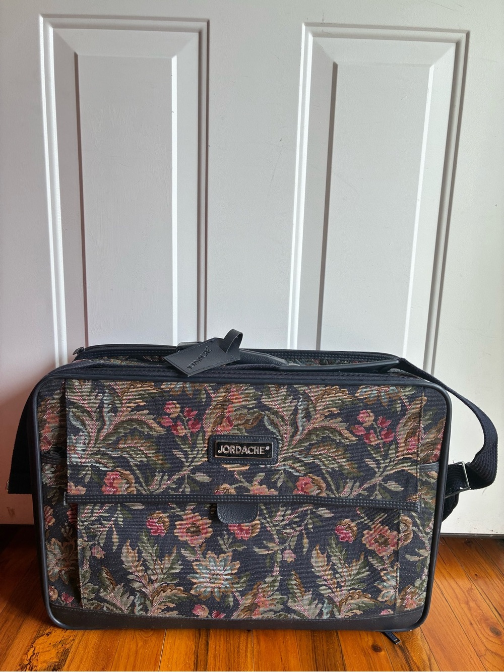 Jordache Black Leather Luggage Tag on Floral Tapestry Bag